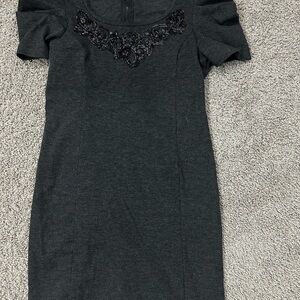 Elegant Black Dress with Embellished Neckline